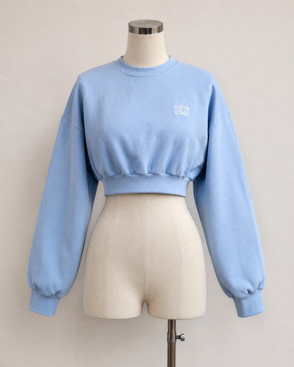 NWOT Living Cool Baby Blue Embroidered Wavy Logo Cropped Long Sleeve Sweatshirt